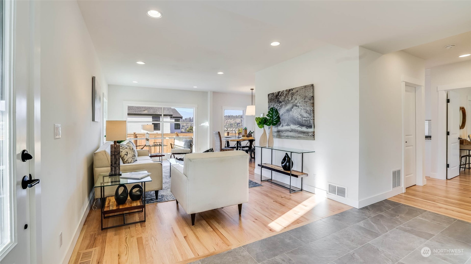 1018 North 34th Street Renton, WA 98056 - Photo 7 of 40 a living room with furniture and a wooden floor