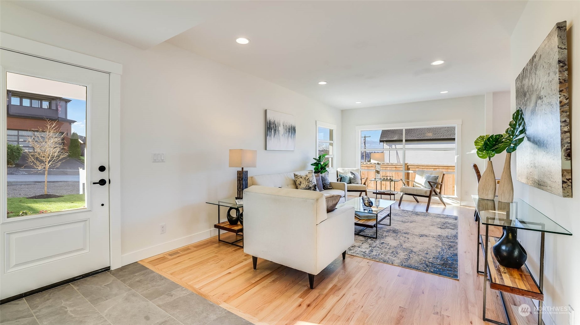 1018 North 34th Street Renton, WA 98056 - Photo 8 of 40 a living room with furniture and a wooden floor