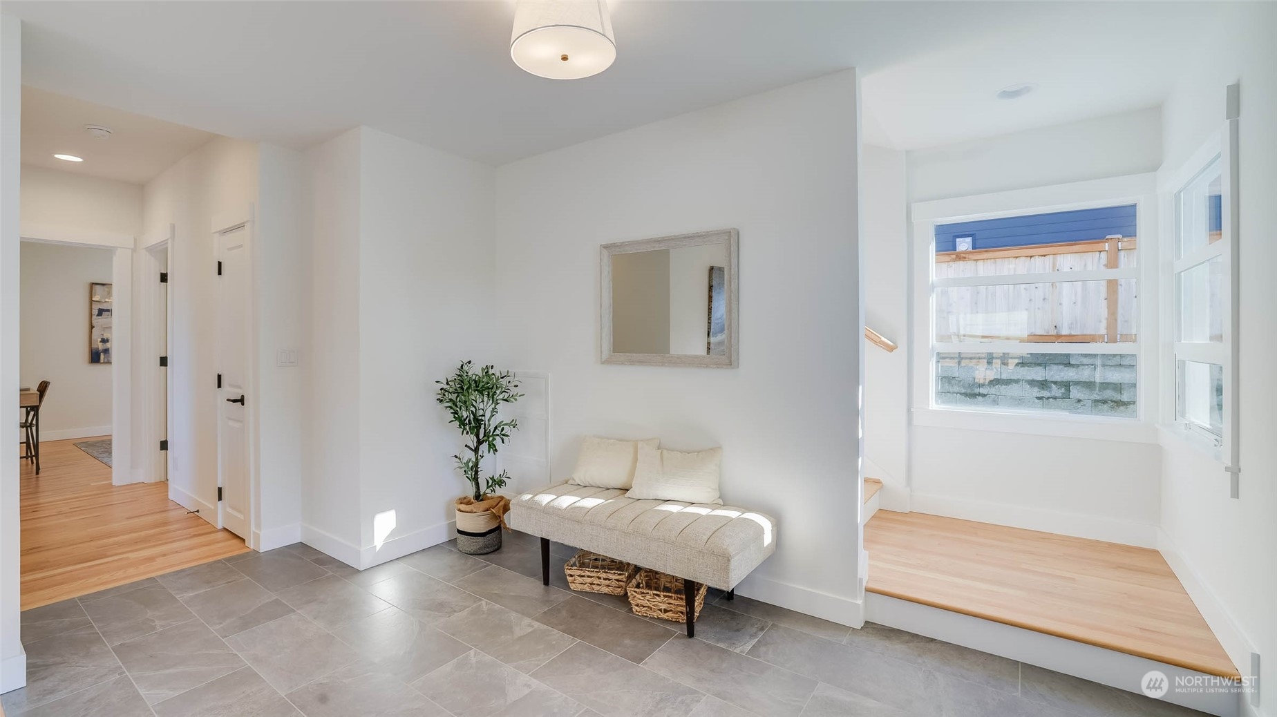 1018 North 34th Street Renton, WA 98056 - Photo 10 of 40 a spacious bedroom with a bed and a window