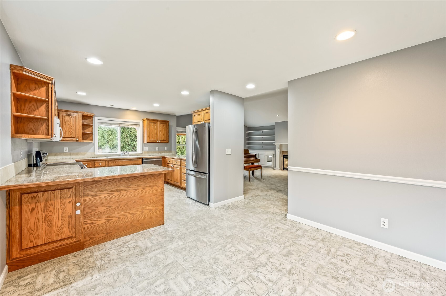 1503 Castlerock Avenue Wenatchee, WA 98801 - Photo 16 of 37 a kitchen with stainless steel appliances a refrigerator and a sink