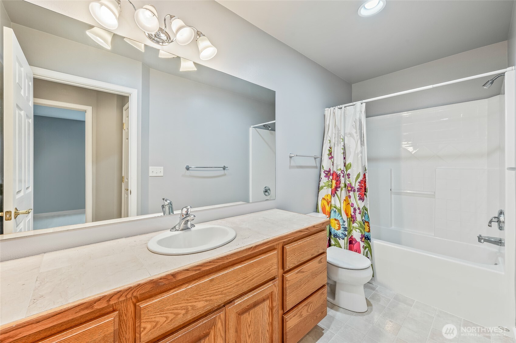 1503 Castlerock Avenue Wenatchee, WA 98801 - Photo 17 of 37 a bathroom with a sink a toilet and a mirror