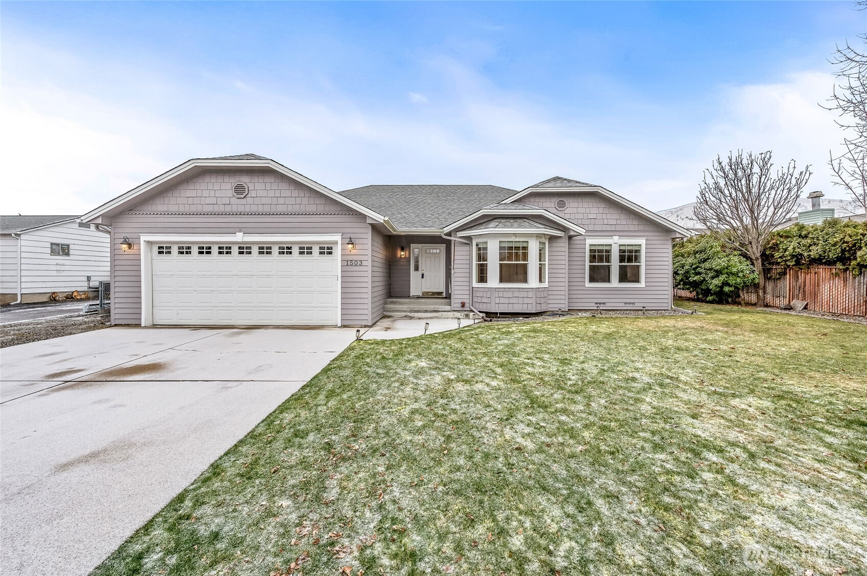 1503 Castlerock Avenue Wenatchee, WA 98801 - Photo 2 of 37 a view of a house with a yard and large trees