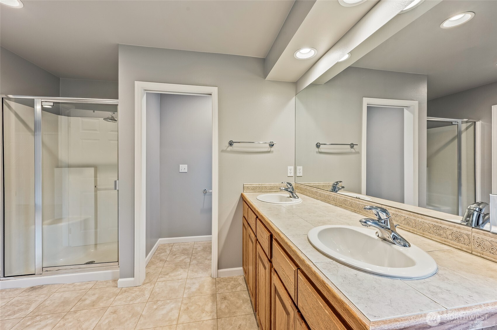 1503 Castlerock Avenue Wenatchee, WA 98801 - Photo 26 of 37 a bathroom with a sink double vanity and a mirror