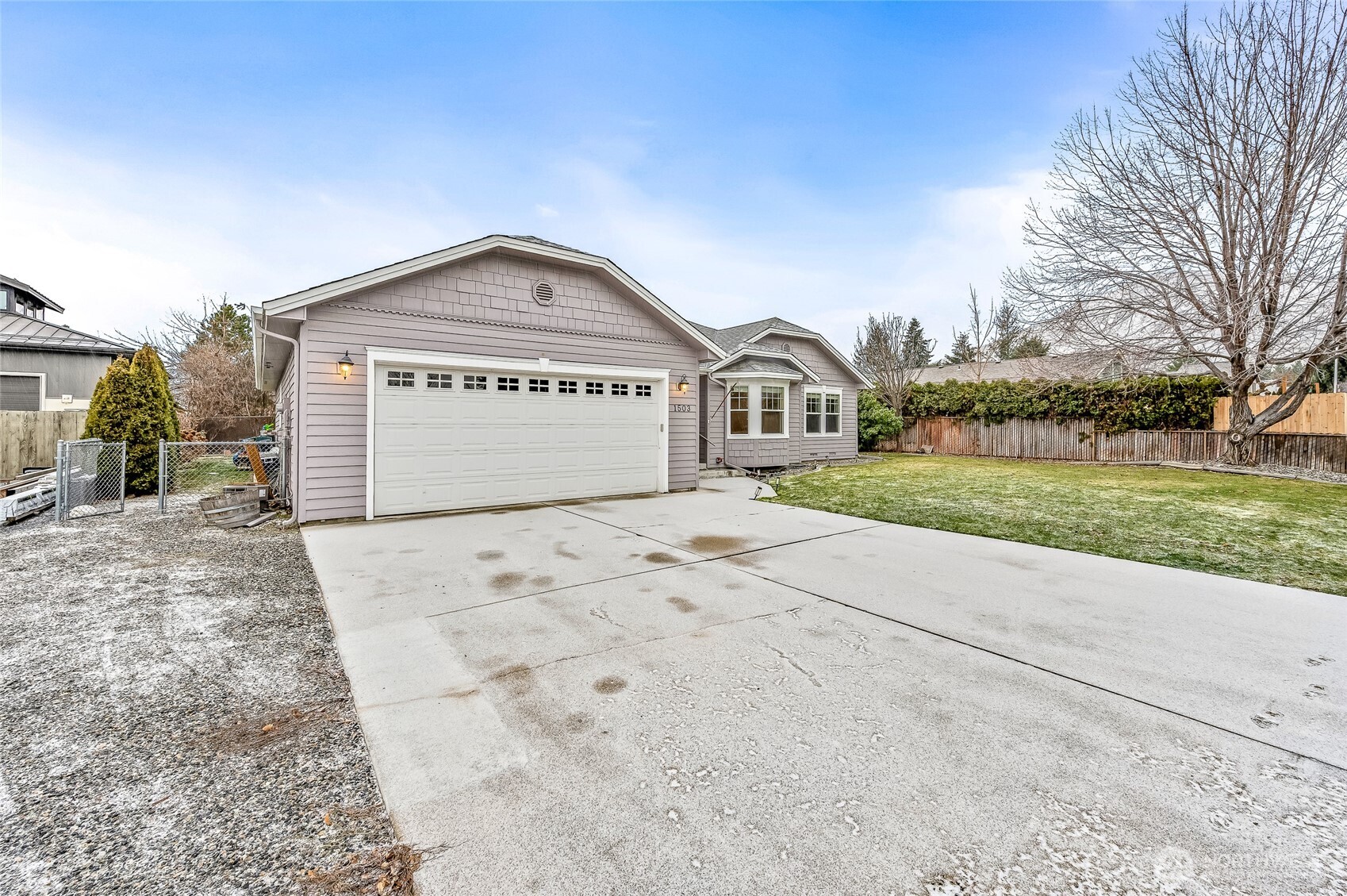 1503 Castlerock Avenue Wenatchee, WA 98801 - Photo 37 of 37 a view of white house with a yard and garage