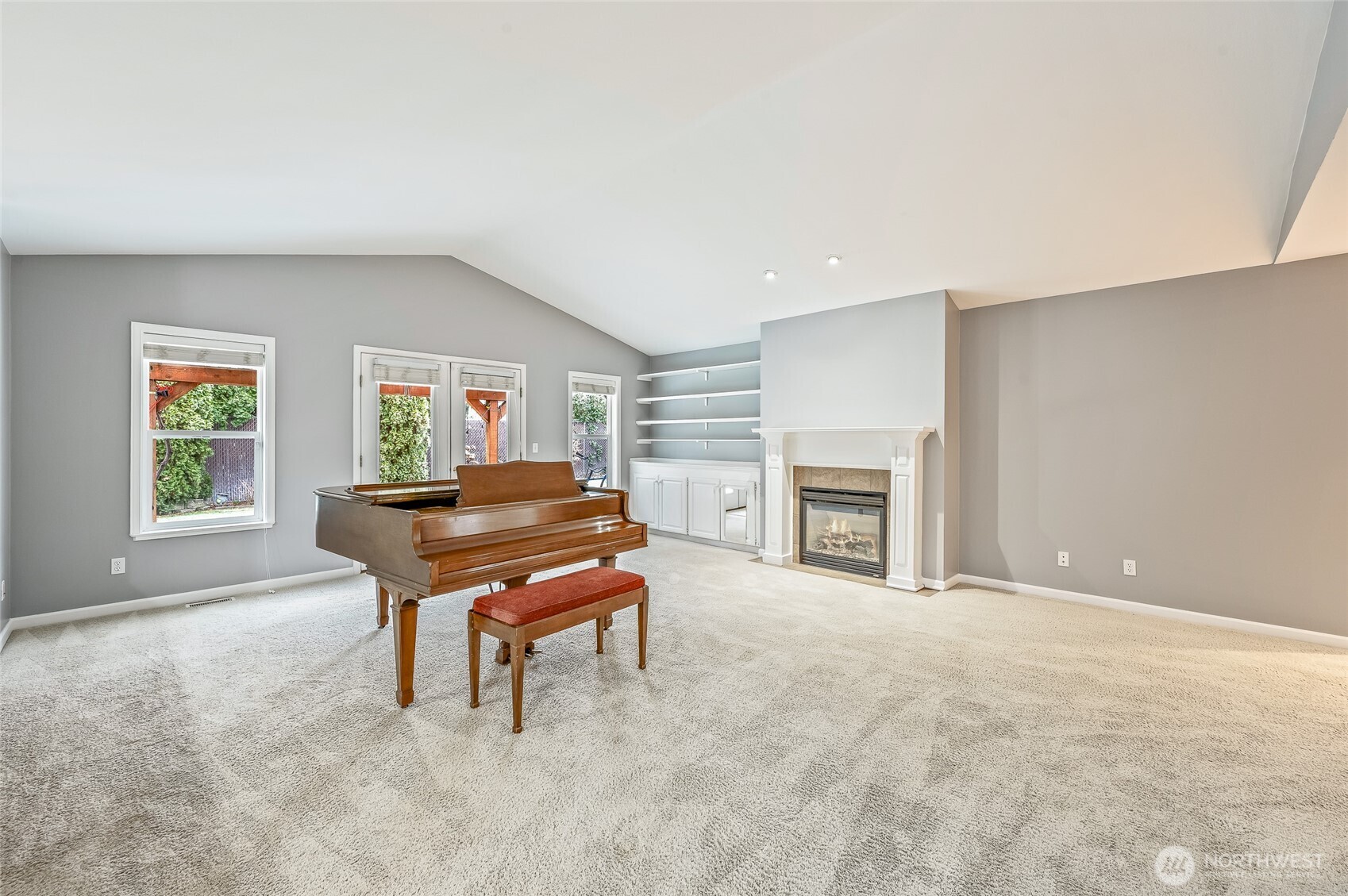 1503 Castlerock Avenue Wenatchee, WA 98801 - Photo 9 of 37 a living room with furniture a piano and a fireplace