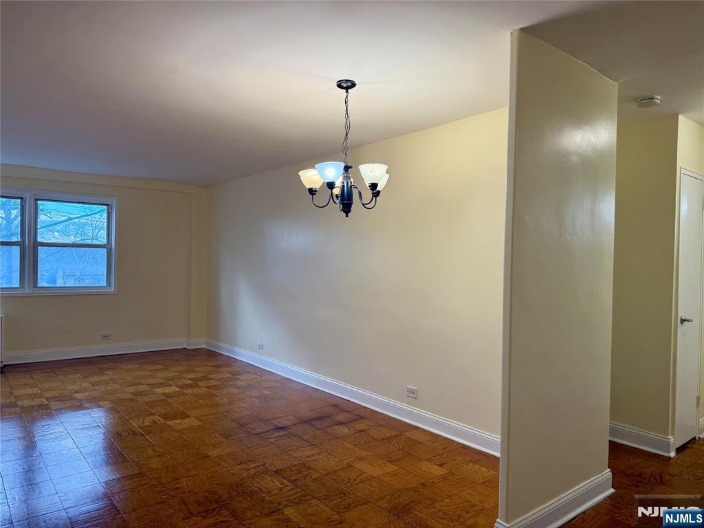 39 East 39th Street, Unit 3H Paterson, NJ 07514 - Photo 10 of 19 a view of a room with a chandelier