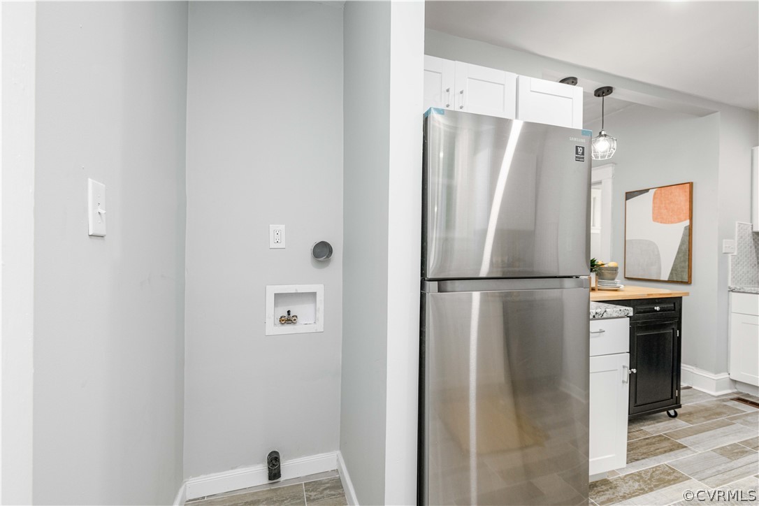 3103 Letcher Avenue Richmond, VA 23222 - Photo 26 of 50 a metallic refrigerator freezer sitting inside of a kitchen