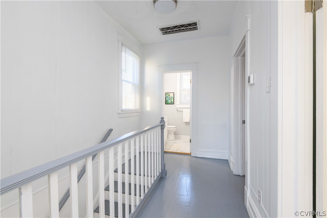 3103 Letcher Avenue Richmond, VA 23222 - Photo 30 of 50 a view of a hallway with wooden floor and windows