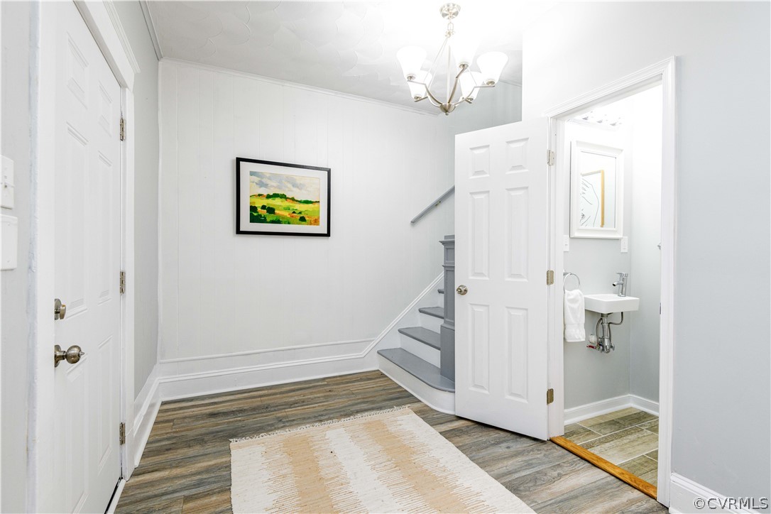 3103 Letcher Avenue Richmond, VA 23222 - Photo 9 of 50 a view of a hallway with wooden floor and staircase