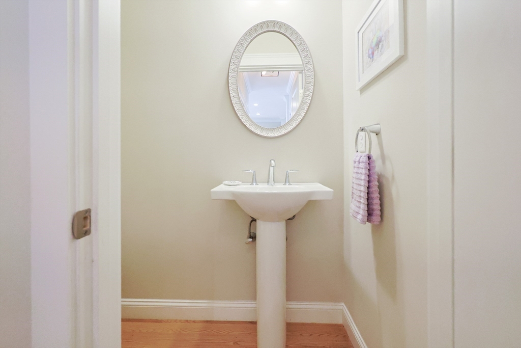 47 Compass Point Drive, Unit 47 Douglas, MA 01516 - Photo 13 of 32 a bathroom with a sink and a mirror