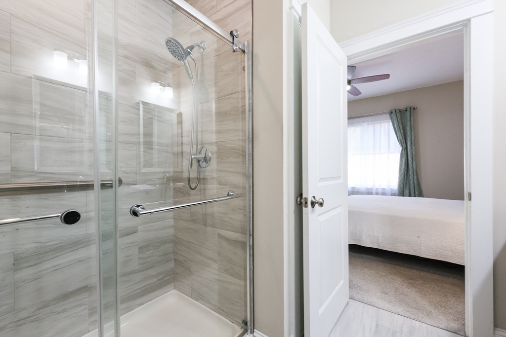 47 Compass Point Drive, Unit 47 Douglas, MA 01516 - Photo 17 of 32 a bathroom with a bathtub and a shower