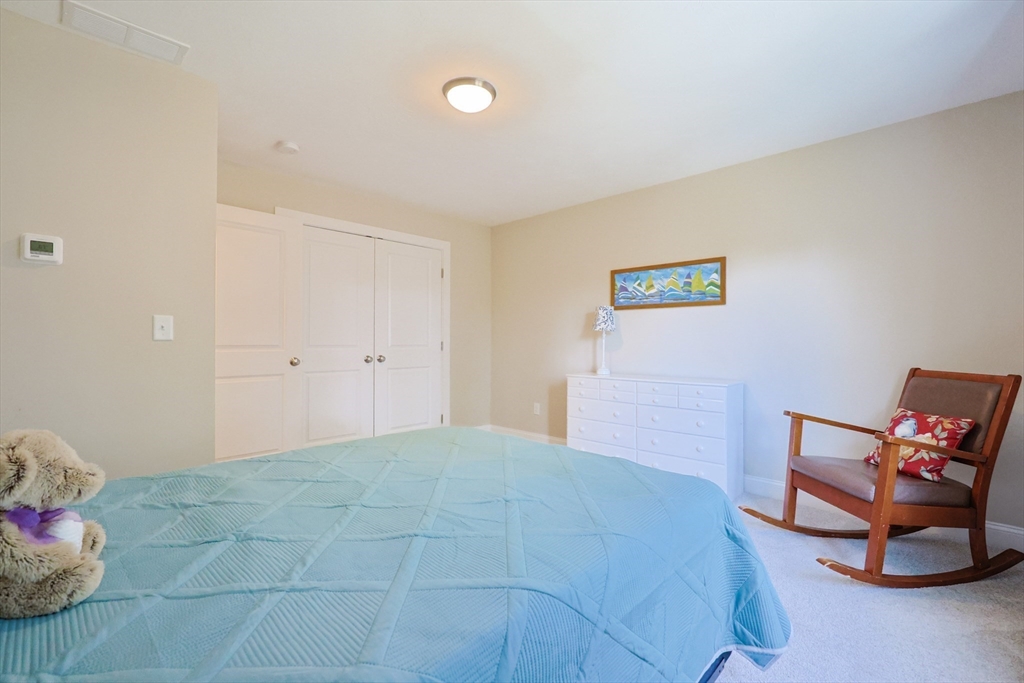 47 Compass Point Drive, Unit 47 Douglas, MA 01516 - Photo 22 of 32 a bedroom with a bed and a window