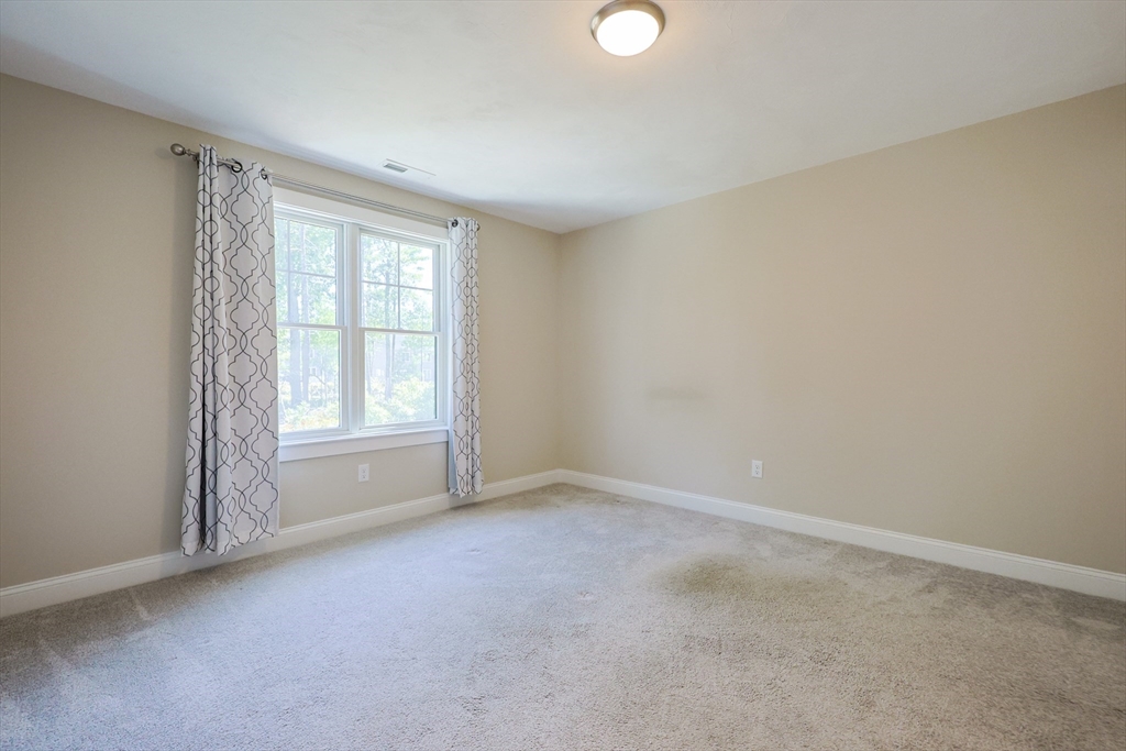 47 Compass Point Drive, Unit 47 Douglas, MA 01516 - Photo 26 of 32 an empty room with a window