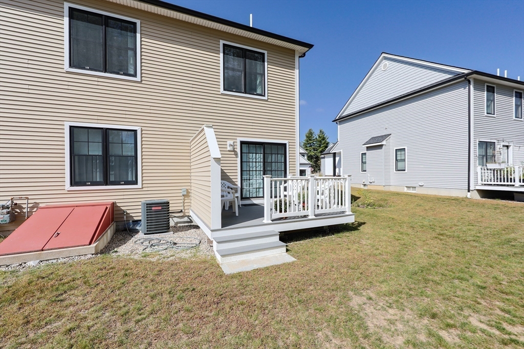 47 Compass Point Drive, Unit 47 Douglas, MA 01516 - Photo 27 of 32 a view of a house with backyard and furniture