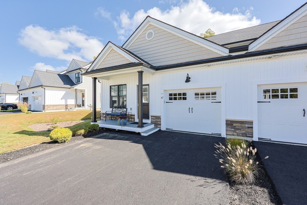 47 Compass Point Drive, Unit 47 Douglas, MA 01516 - Photo 31 of 32 a view of a house with patio