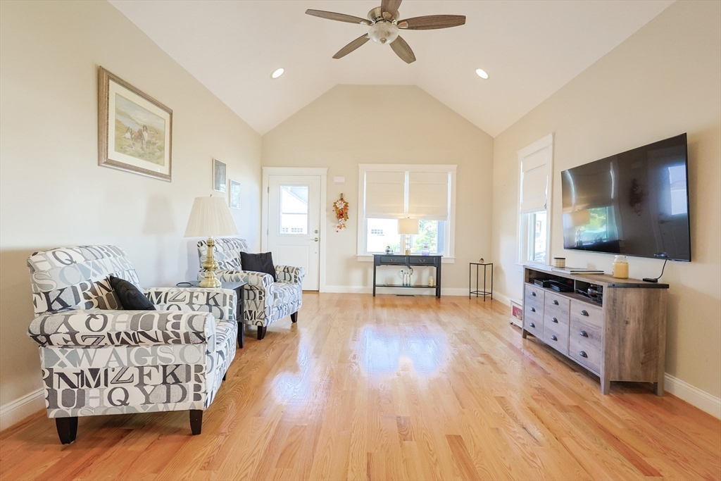 47 Compass Point Drive, Unit 47 Douglas, MA 01516 - Photo 5 of 32 a living room with furniture and a flat screen tv