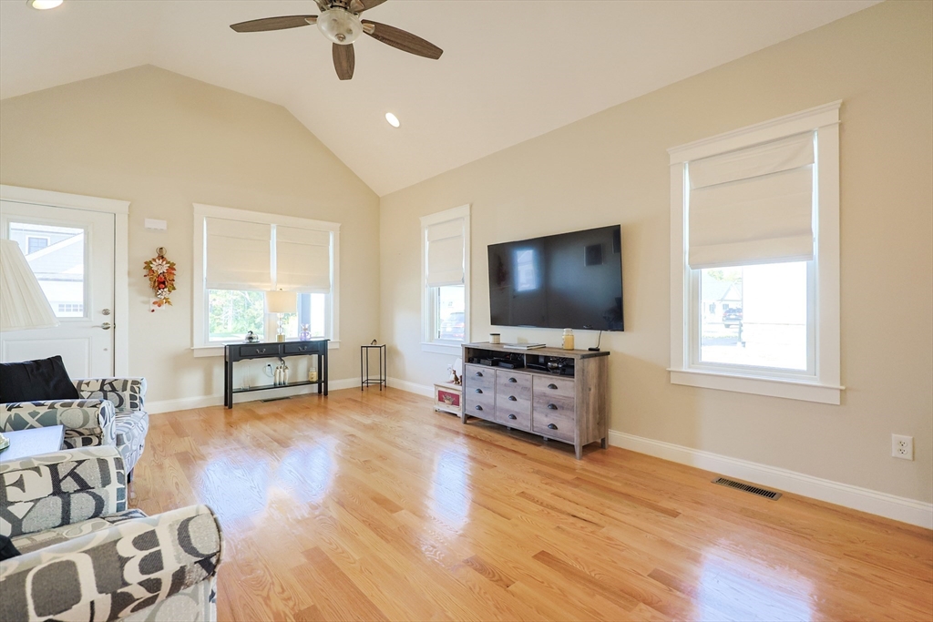 47 Compass Point Drive, Unit 47 Douglas, MA 01516 - Photo 6 of 32 a living room with furniture and a flat screen tv