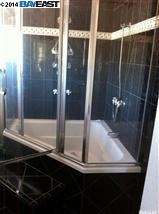 5756 Grant Line Road Tracy, CA 95304 - Photo 8 of 12 a bathroom with a bathtub