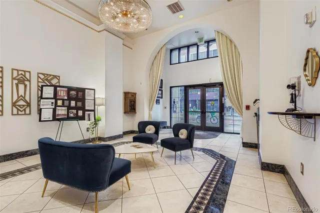 a kitchen with stainless steel appliances and granite countertop white cabinets