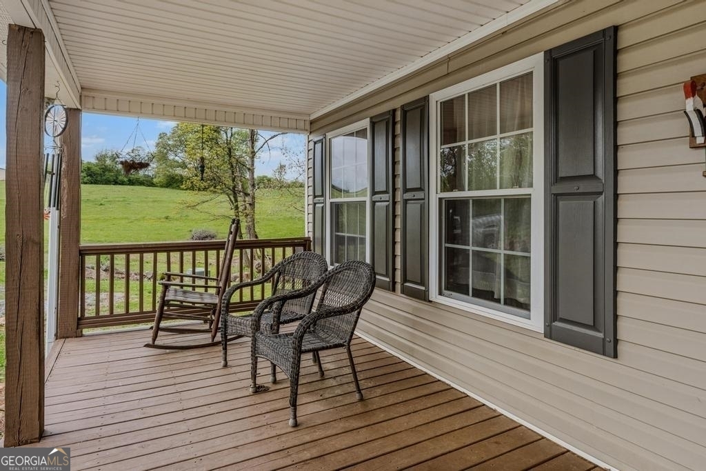 80 Upper Caldwell Road Bowdon, GA 30108 - Photo 24 of 33 a view of a wooden chairs on the deck