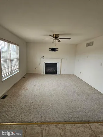 a view of empty room with windows