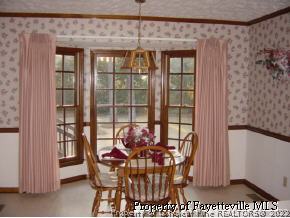 7775 Dragonhead Road Fayetteville, NC 28311 - Photo 10 of 12 a dining room with furniture and window