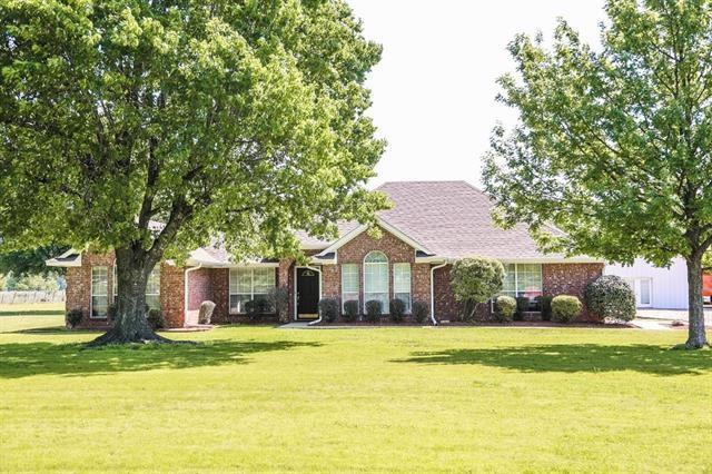 2142 County Road Paris, TX 75460 - Photo 1 of 1 a front view of house with yard and green space