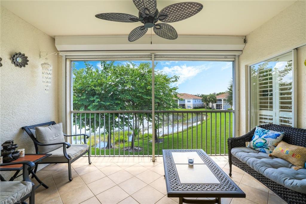 3047 Horizon Lane, Unit 1908 Naples, FL 34109 - Photo 15 of 17 Sunroom with plenty of natural light and ceiling fan