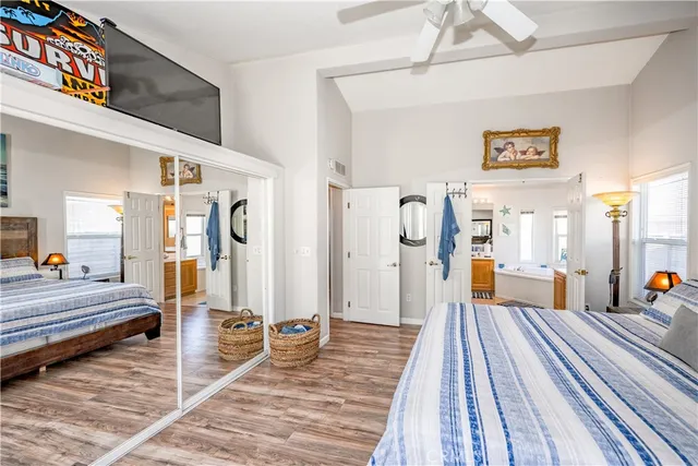 a spacious bedroom with a bed and a table