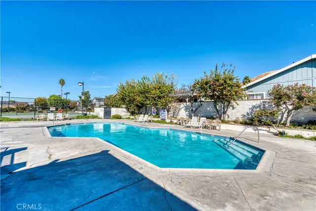 a view of a swimming pool with lounge chair