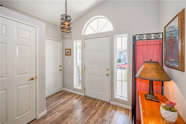 a view of a livingroom with wooden floor and cabinet