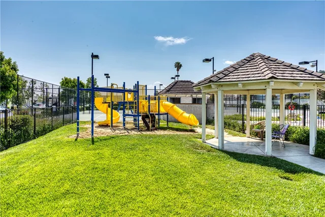 a view of a house with swimming pool and sitting area