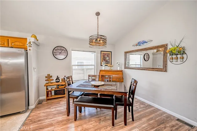 a view of a workspace with furniture and wooden floor