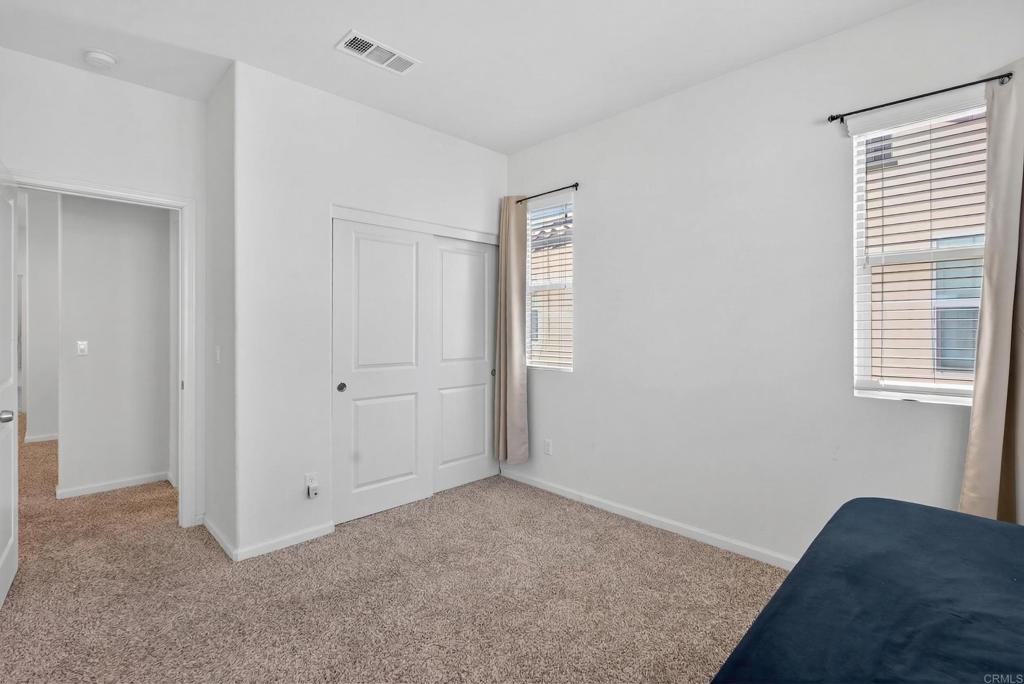 31554 Alicante Loop Winchester, CA 92596 - Photo 24 of 34 a view of a bedroom with closet area