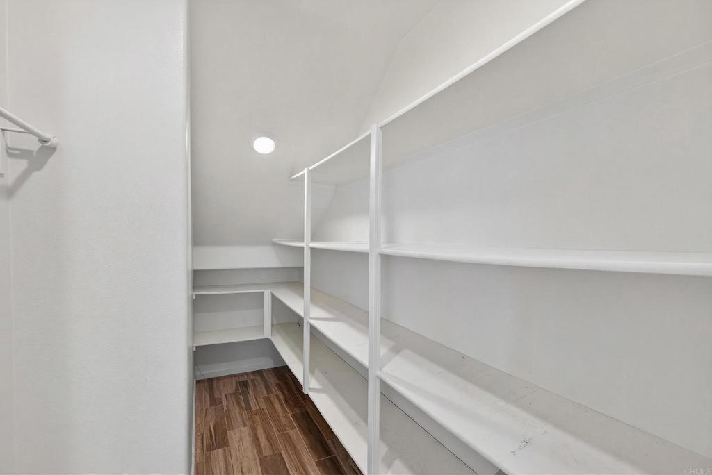 31554 Alicante Loop Winchester, CA 92596 - Photo 8 of 34 a view of walk in closet with empty racks