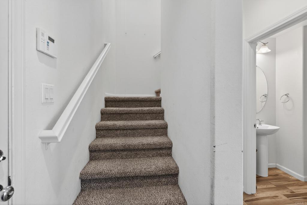 31554 Alicante Loop Winchester, CA 92596 - Photo 10 of 34 a view of staircase with white walls