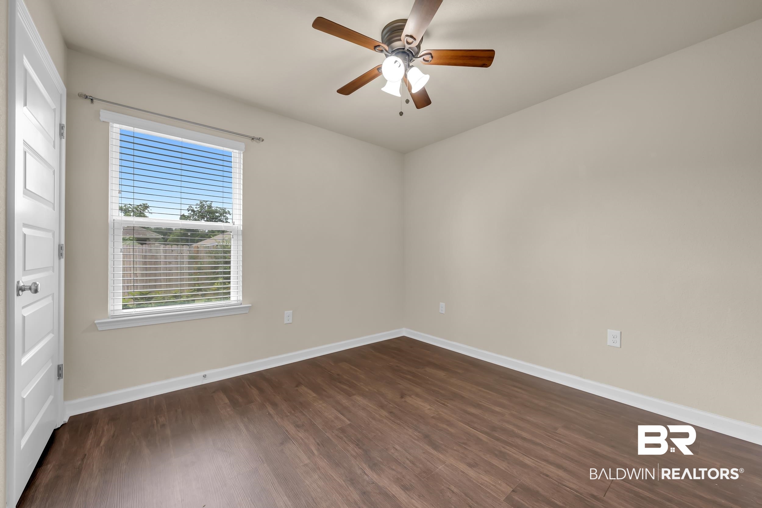 1704 Abbey Loop Foley, AL 36535 - Photo 22 of 38 Room featuring wood-finish flooring, neutral wall tones, and white trim