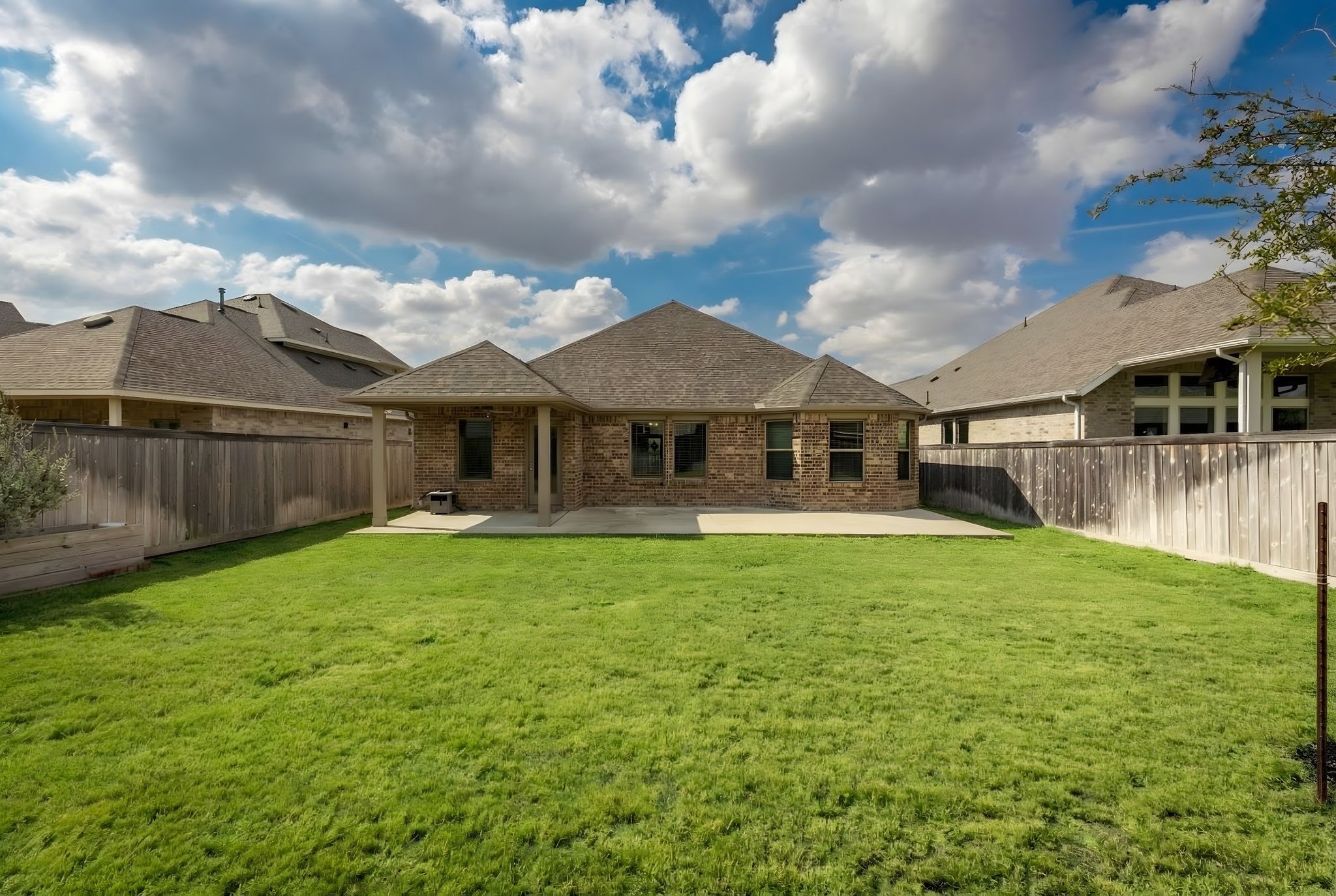 14914 Big Bend Ranch Drive Cypress, TX 77433 - Photo 43 of 49 a backyard of a house with table and chairs