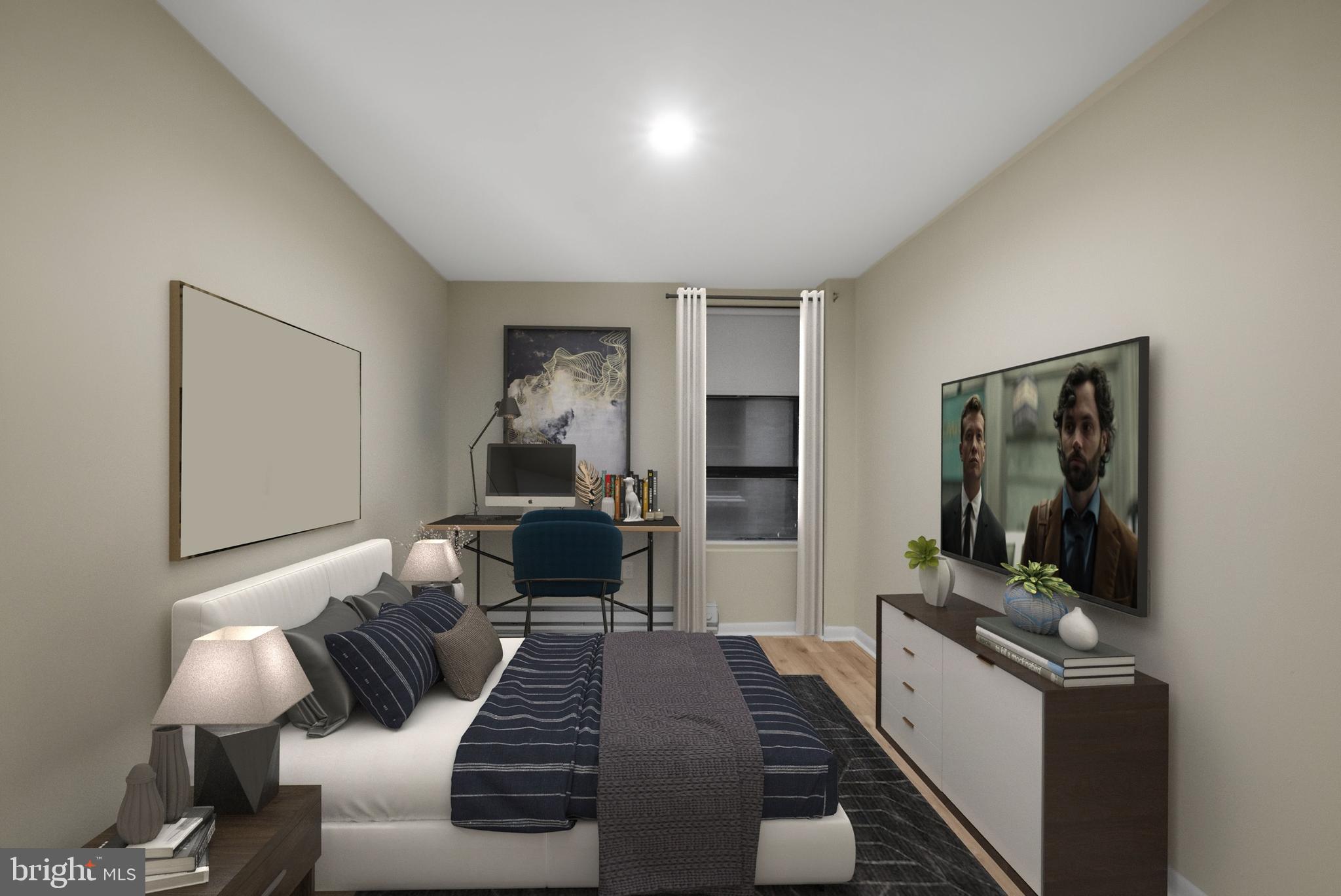 201 South 13th Street, Unit 209 Philadelphia, PA 19107 - Photo 15 of 22 a bedroom with a bed and a couch