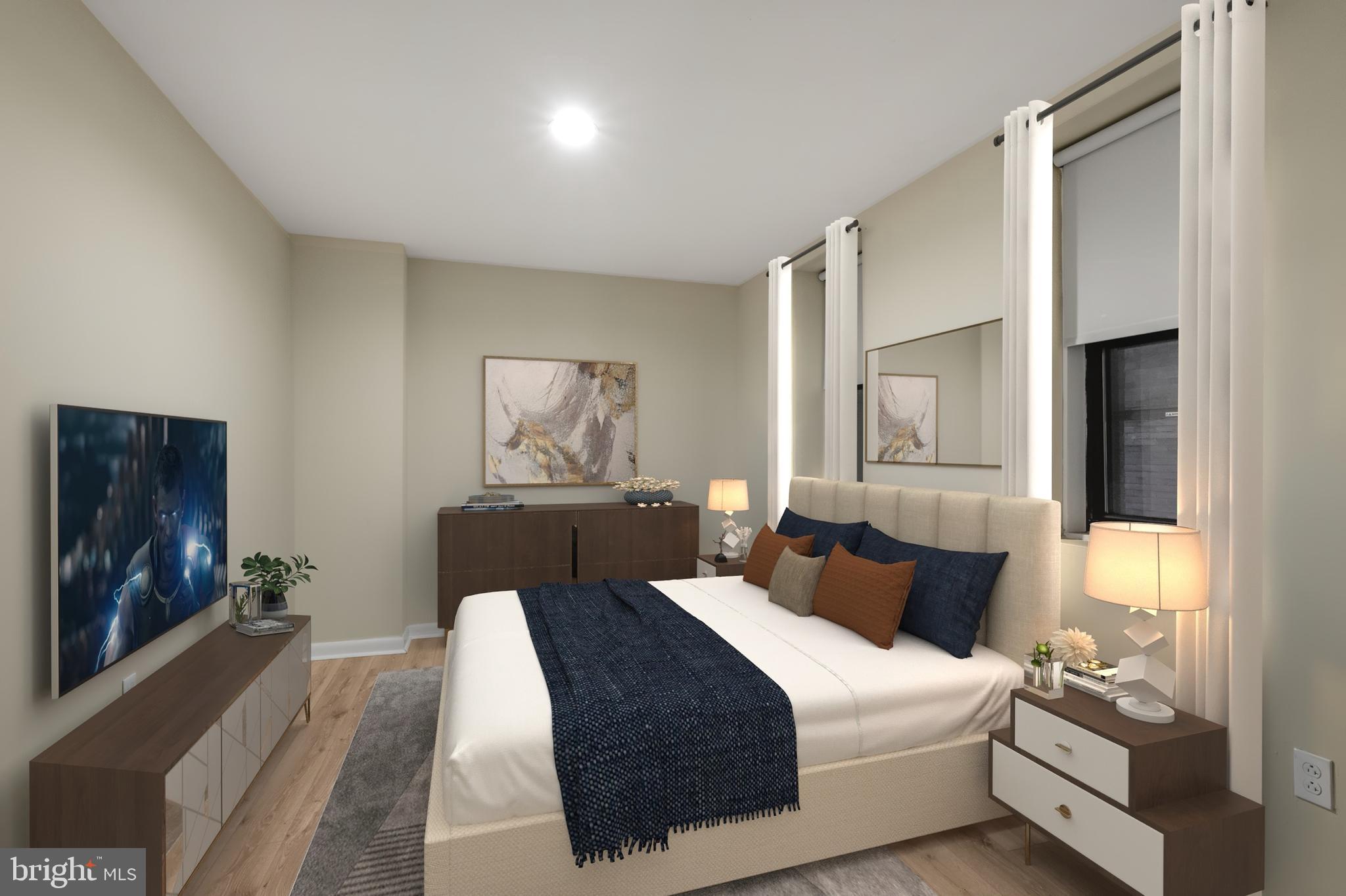 201 South 13th Street, Unit 209 Philadelphia, PA 19107 - Photo 4 of 22 a bedroom with a bed and a painting on the wall