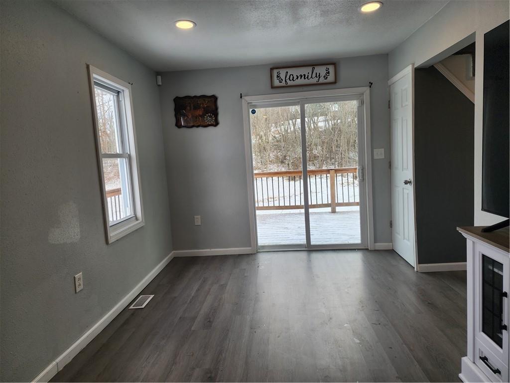 701 Jackson Road Apollo, PA 15613 - Photo 14 of 33 a view of an empty room with wooden floor and a window