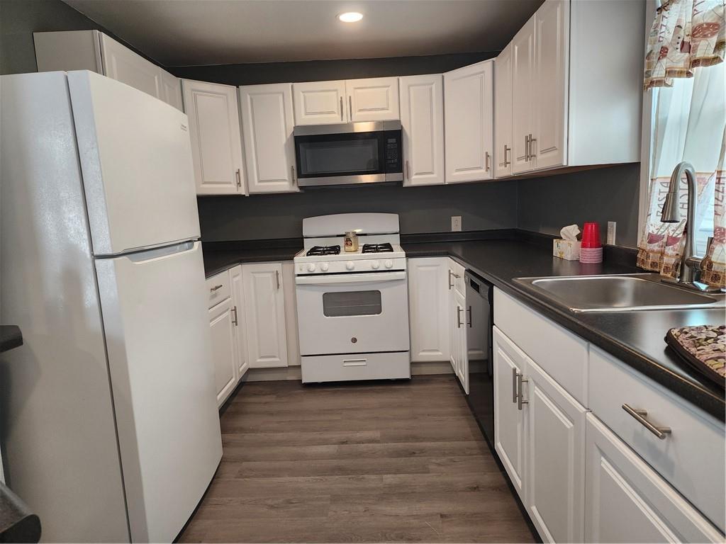 701 Jackson Road Apollo, PA 15613 - Photo 8 of 33 a kitchen with a white cabinets and white appliances