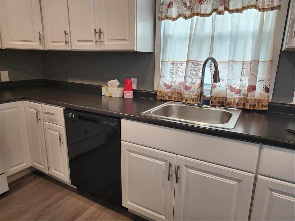 701 Jackson Road Apollo, PA 15613 - Photo 10 of 33 a kitchen with a sink cabinets and a wooden floor