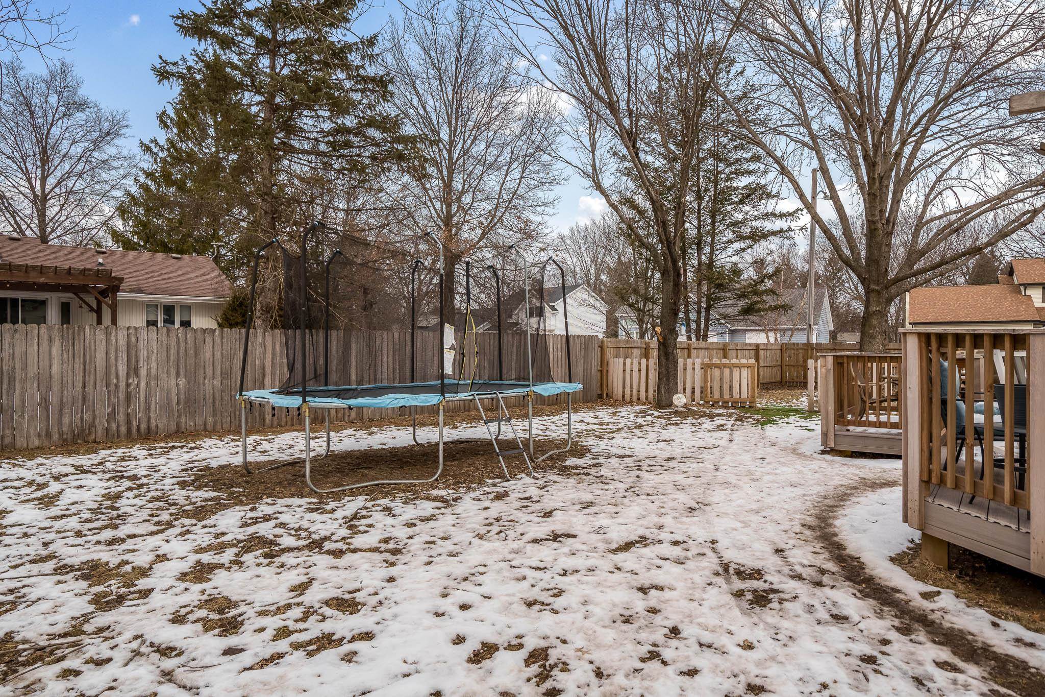 1245 Aldrin Road Rockton, IL 61072 - Photo 31 of 41 a view of a bench in the backyard of a house