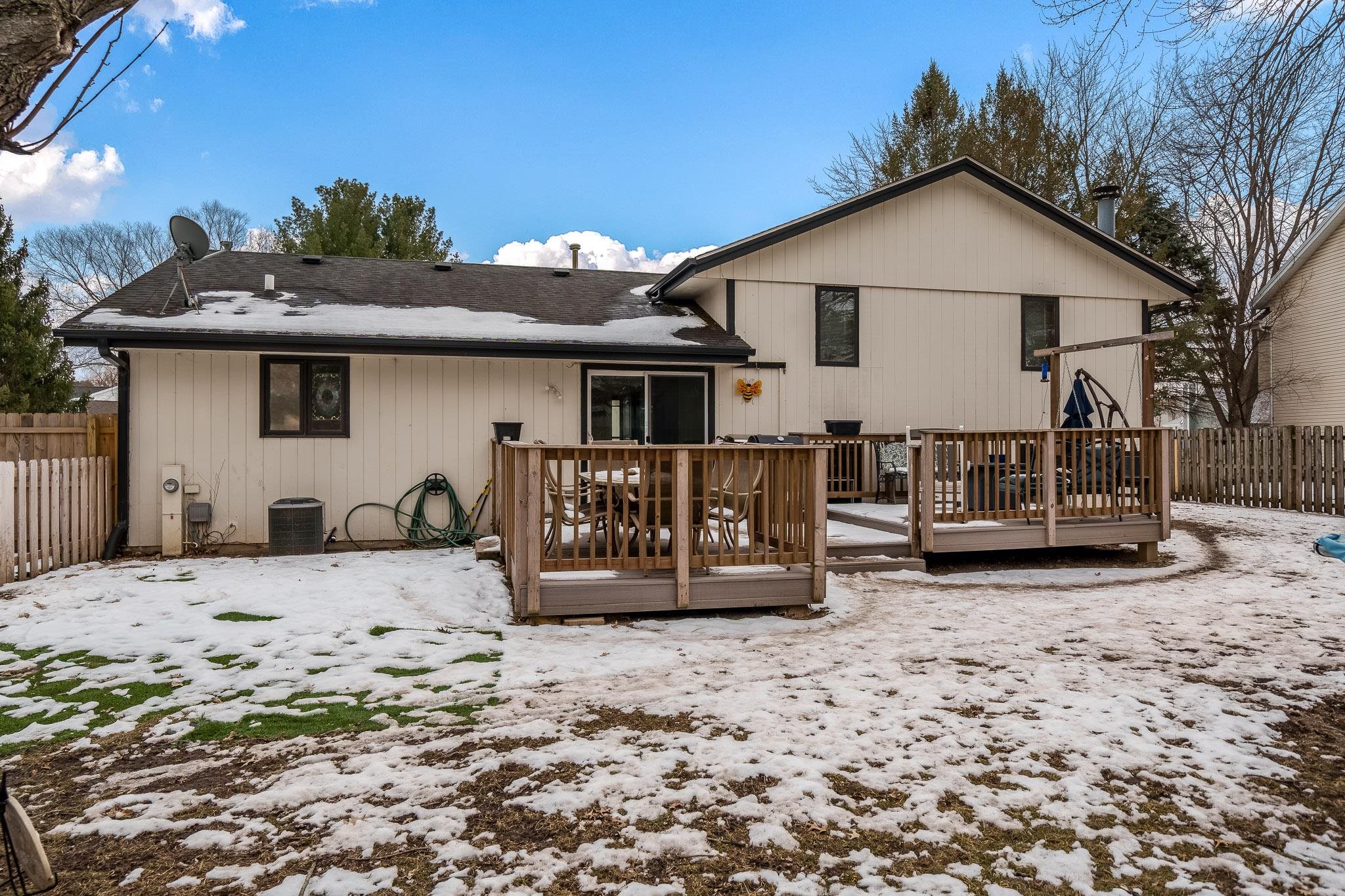 1245 Aldrin Road Rockton, IL 61072 - Photo 33 of 41 a view of a house with wooden fence in front of house