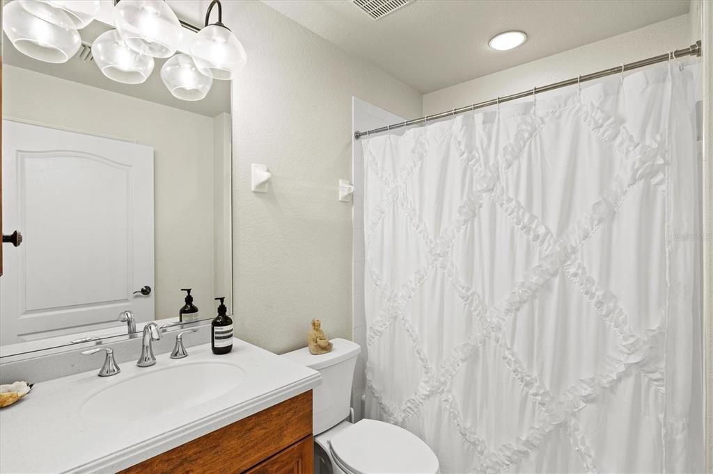 1000 San Lino Circle, Unit 1032 Venice, FL 34292 - Photo 19 of 88 a bathroom with a sink vanity mirror and toilet