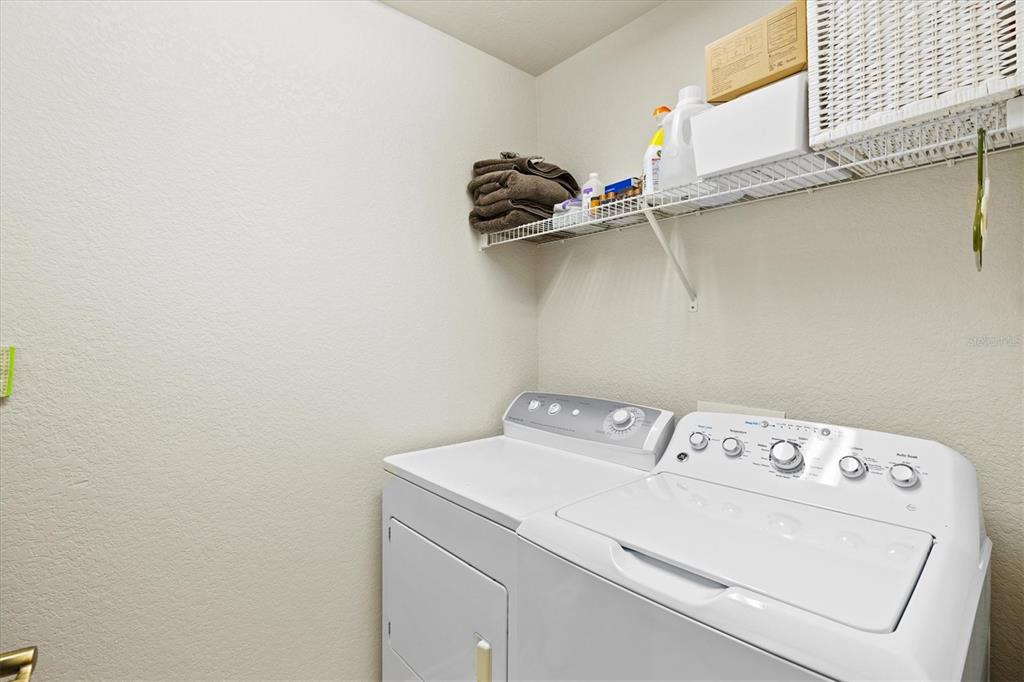 1000 San Lino Circle, Unit 1032 Venice, FL 34292 - Photo 20 of 88 a utility room with dryer and washer