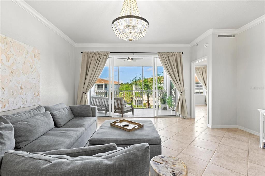 1000 San Lino Circle, Unit 1032 Venice, FL 34292 - Photo 21 of 88 a living room with furniture and a large window