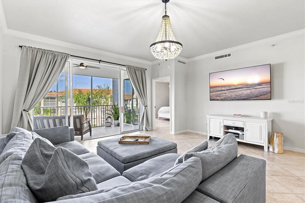 1000 San Lino Circle, Unit 1032 Venice, FL 34292 - Photo 22 of 88 a living room with furniture and a large window