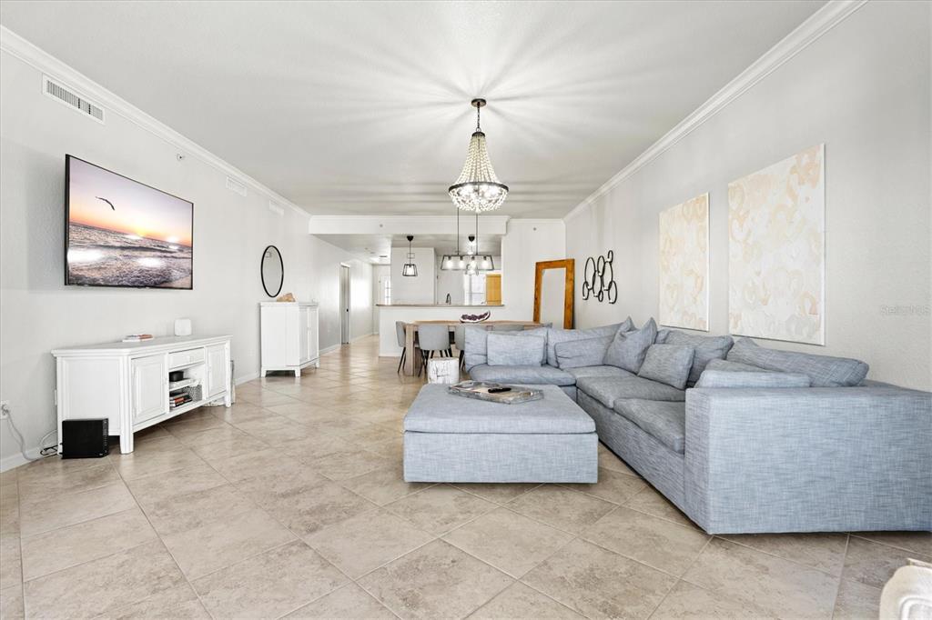 1000 San Lino Circle, Unit 1032 Venice, FL 34292 - Photo 24 of 88 a living room with furniture and a chandelier